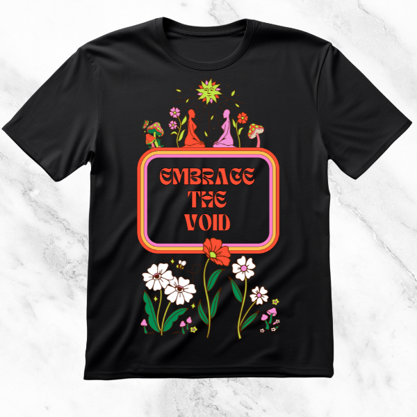 Black T-shirt with the slogan 'Embrace the Void' in retro typography, surrounded by floral illustrations, whimsical figures, and bright, playful imagery, merging existential themes with a cheerful aesthetic.