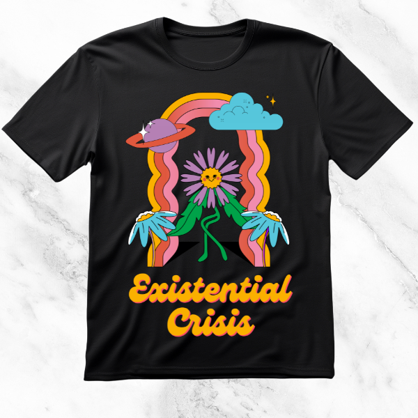 Black T-shirt with 'Existential Crisis' written in bold, retro typography, featuring playful illustrations of a flower with a smiling face, rainbows, clouds, and planets, combining a whimsical aesthetic with an existential theme.