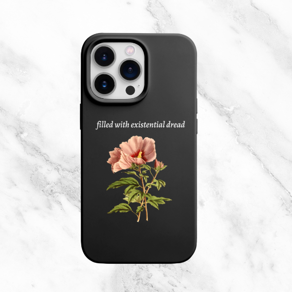 Black phone case featuring the phrase 'Filled with Existential Dread' above a single pink flower illustration, capturing a delicate aesthetic paired with a dark, introspective theme.